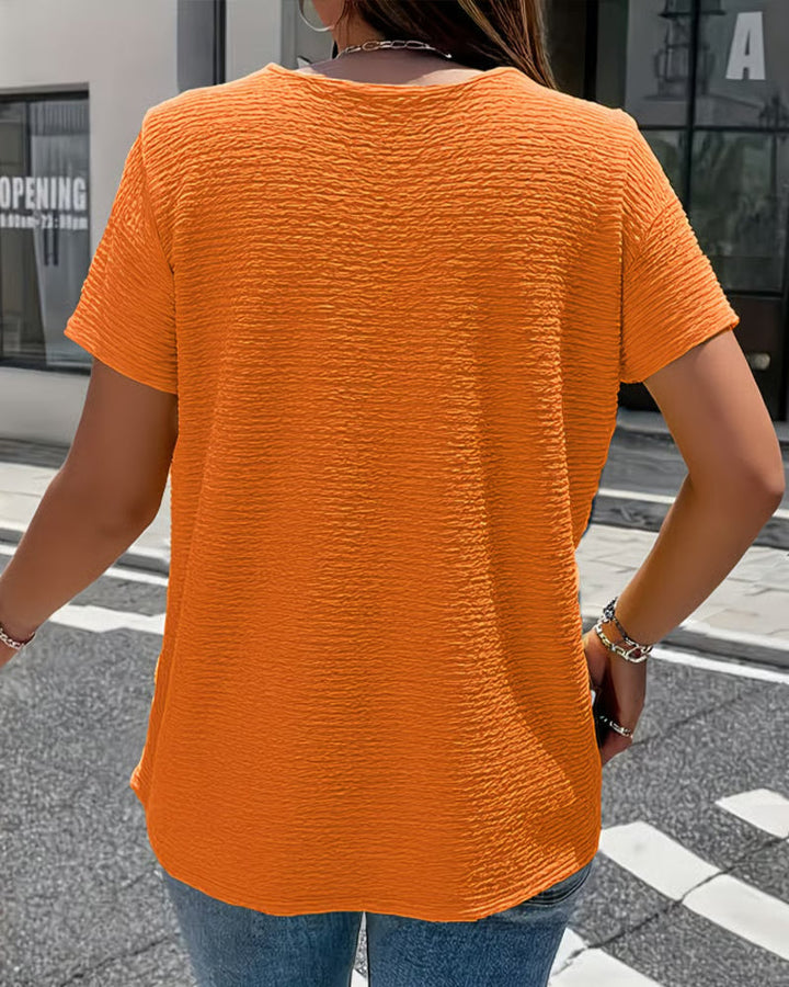 Quintessa - V-Ausschnitt-Bluse mit Knopfdetail