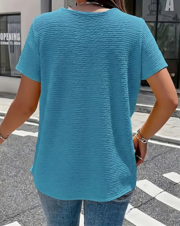 Quintessa - V-Ausschnitt-Bluse mit Knopfdetail