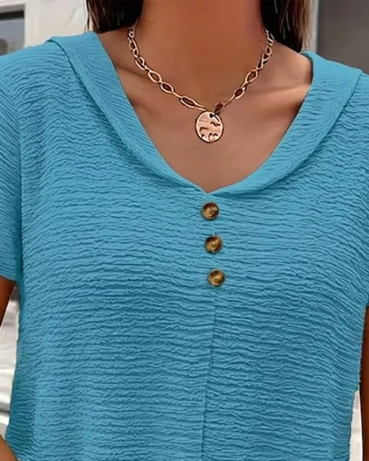 Quintessa - V-Ausschnitt-Bluse mit Knopfdetail