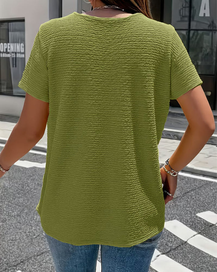 Quintessa - V-Ausschnitt-Bluse mit Knopfdetail